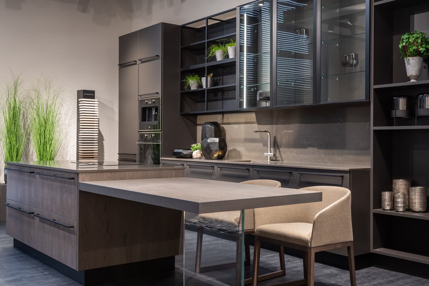 Contemporary kitchen renovation in charcoal cabinetry with a timber island that extends into a built-in dining table